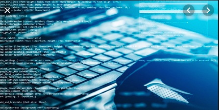 Picture of a hand on a computer keyboard with a lot of font typed out over the image